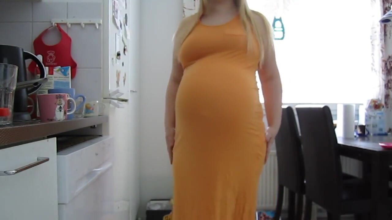 Pregnant belly moving in dress