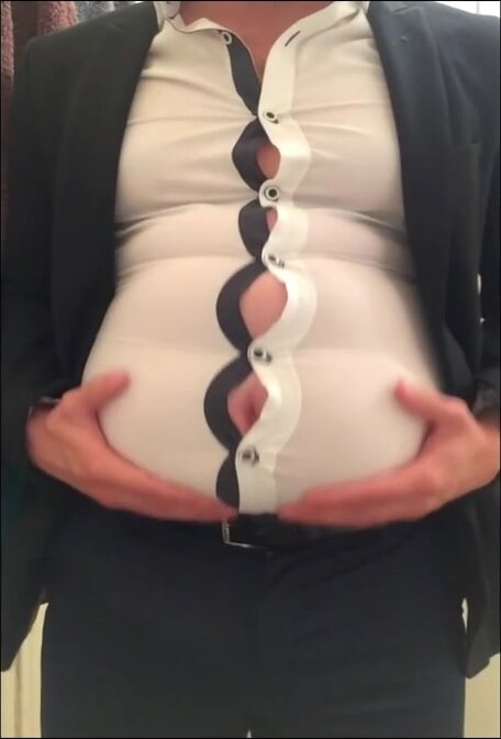 ball gut in a tight suit