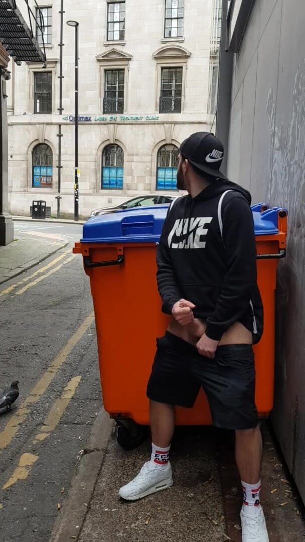 Young exhib guy wanks off in the city centre streets