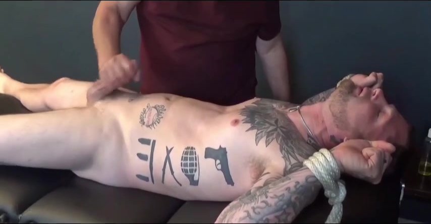 tied stud gets his cock sucked and jerked by older guy