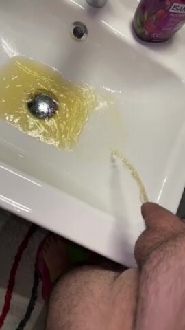 Yellow morning pee in sink