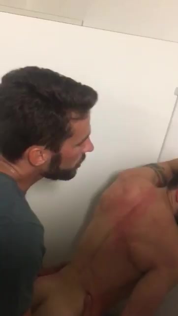 Bareback sex of two white guys in a night club bathroom