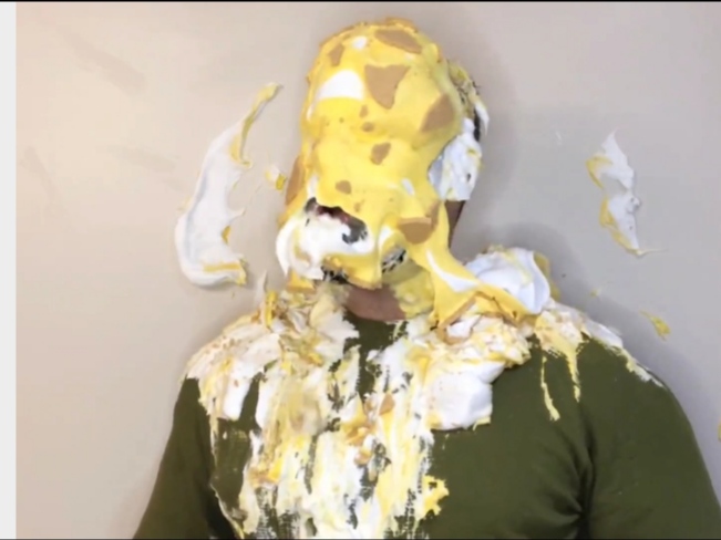 Hot hunk pies himself in the face