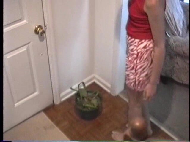 Cute blonde housewife waters plant with pussy