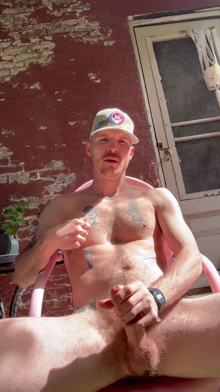 Inked bro bates naked on back patio