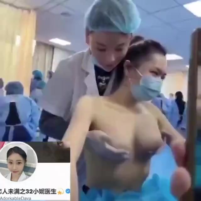 Cute Chinese nurse massages patients breast [3of3]