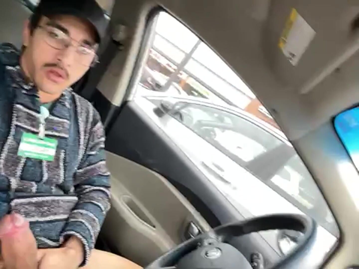 jerking off in his car in a parking lot