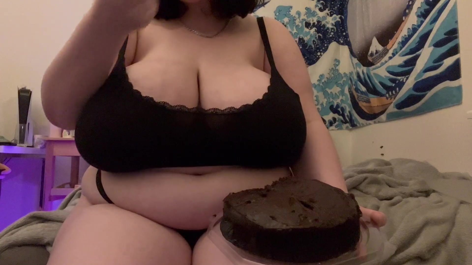 girl with Big boobs and a bigger belly devouring a cake