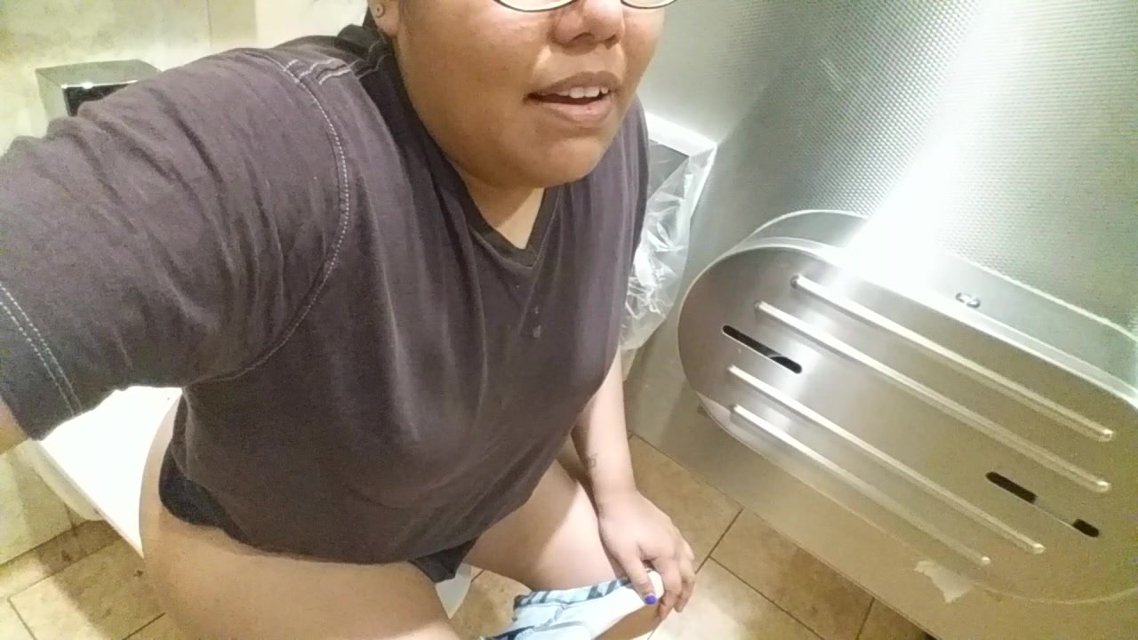 Woman pees in busy restroom