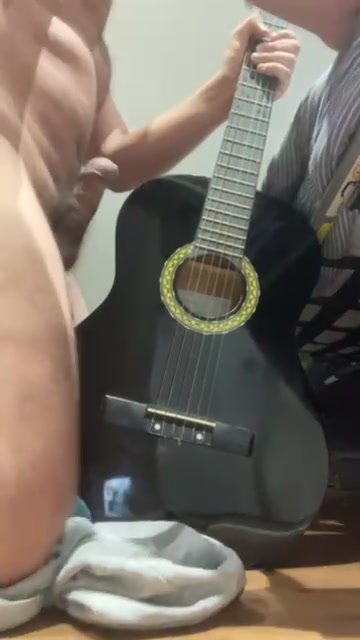 Rubbing cock guitar and cum
