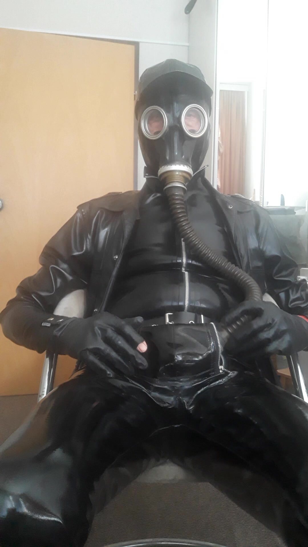 In PVC pants and rubber