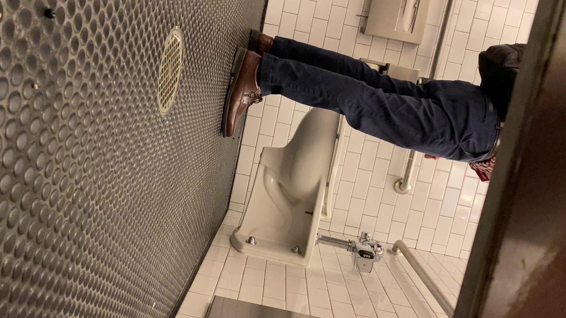 Dude pissing at a conference