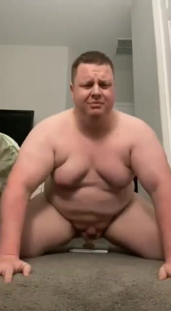 Chubby guy bounces on dildo