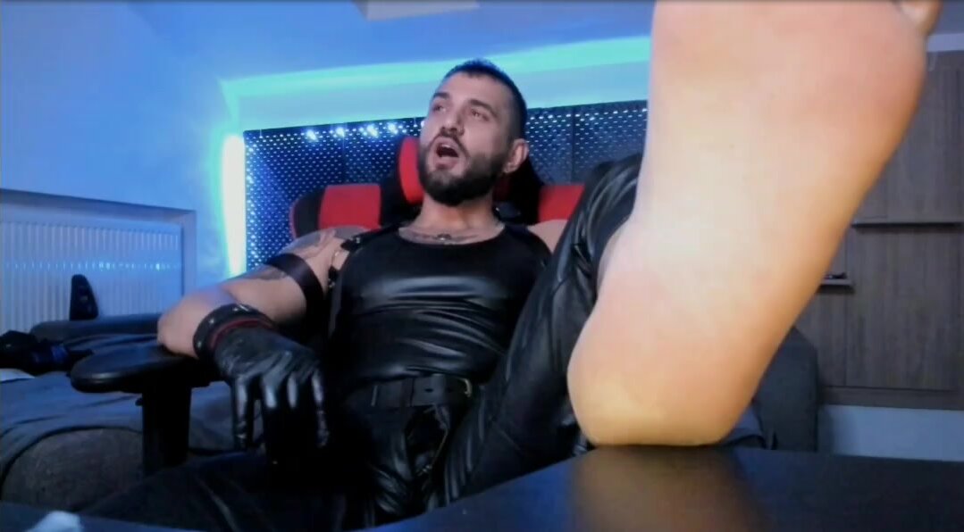Barefoot master in leather