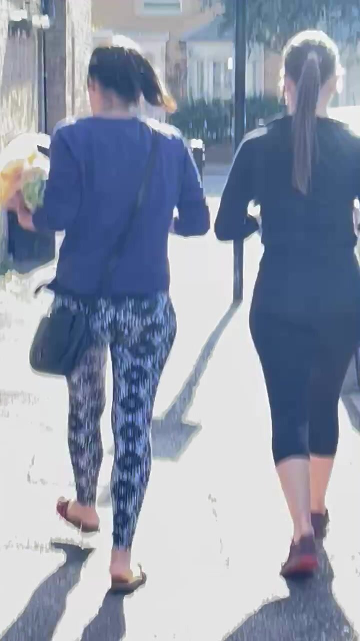 2 slim brunettes walking in yoga pants