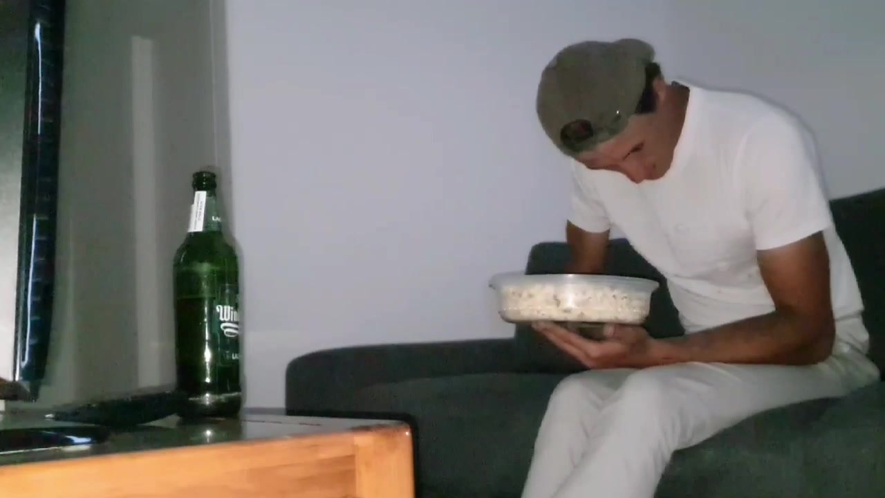Cute guy pisses his pants while watching a movie