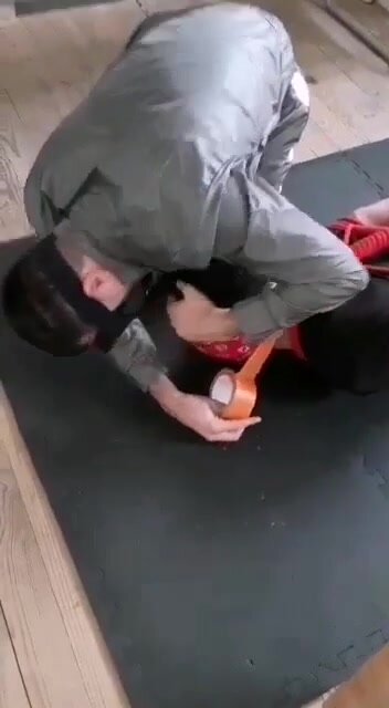 Hogtied guy gets gagged