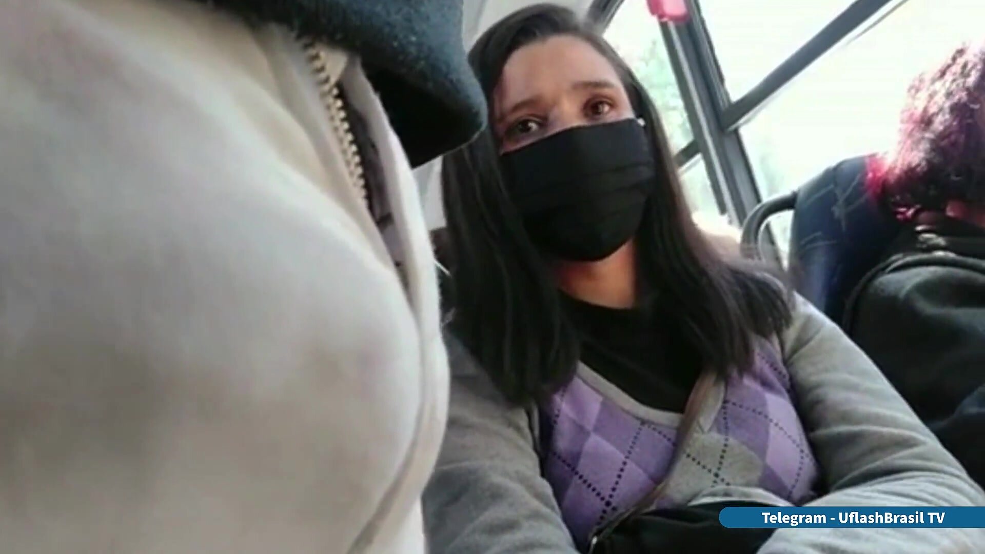 Woman looking bulge flash in bus