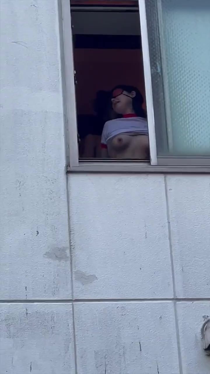 Japanese guy jerks off to girl in window