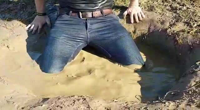 Muddy in skinny jeans in mudhole