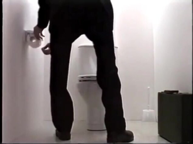 Business Man farting on toilet