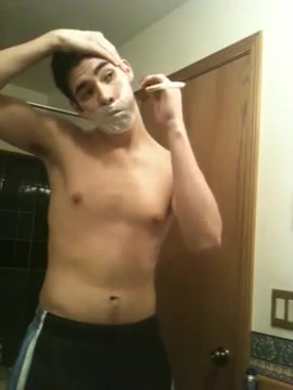 Shiirtless guy shaving (no nudity)