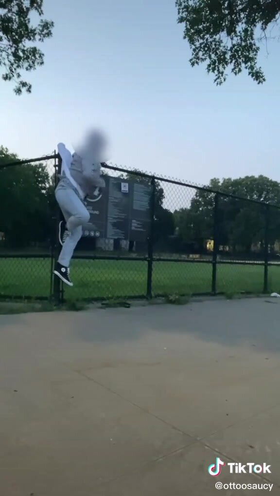 Public Dangling Wedgie From Park Fence