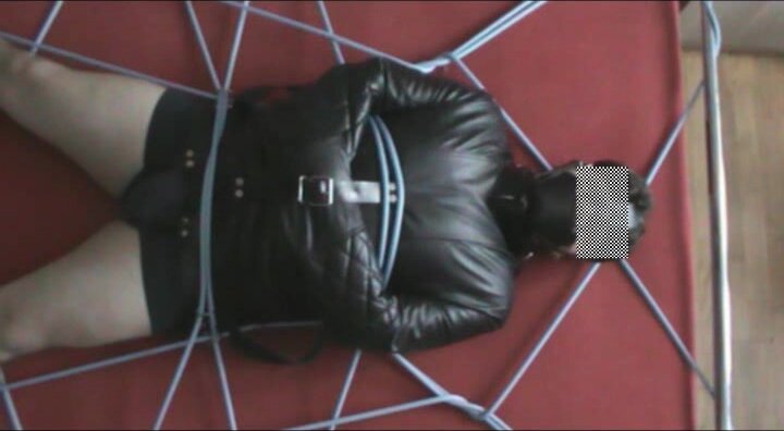Straitjacketed slave is restrained without hope of esca