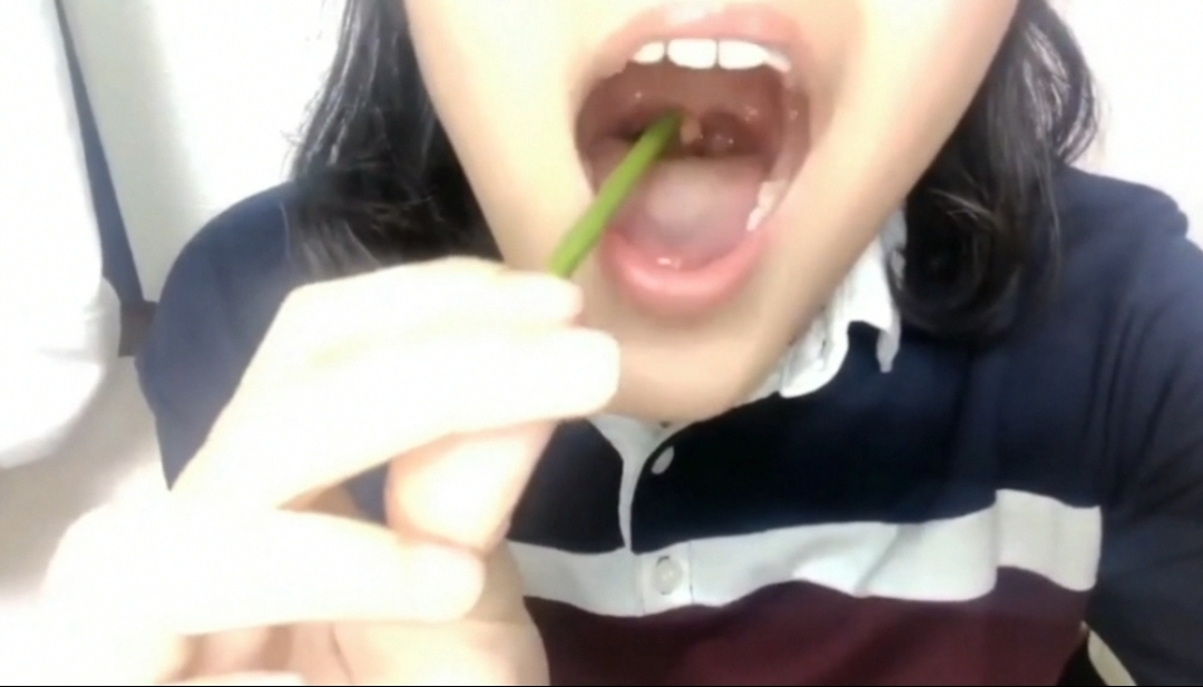 asian girl playing uvula