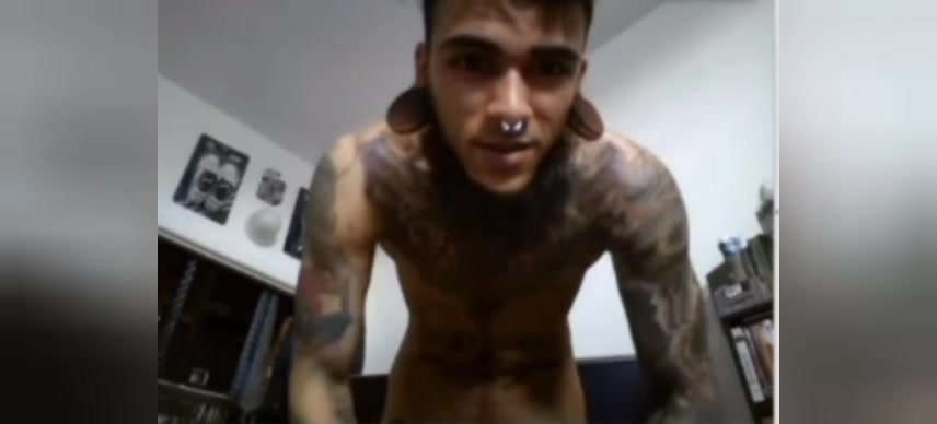 Tattooed guy with piercing wanking and cuming on cam