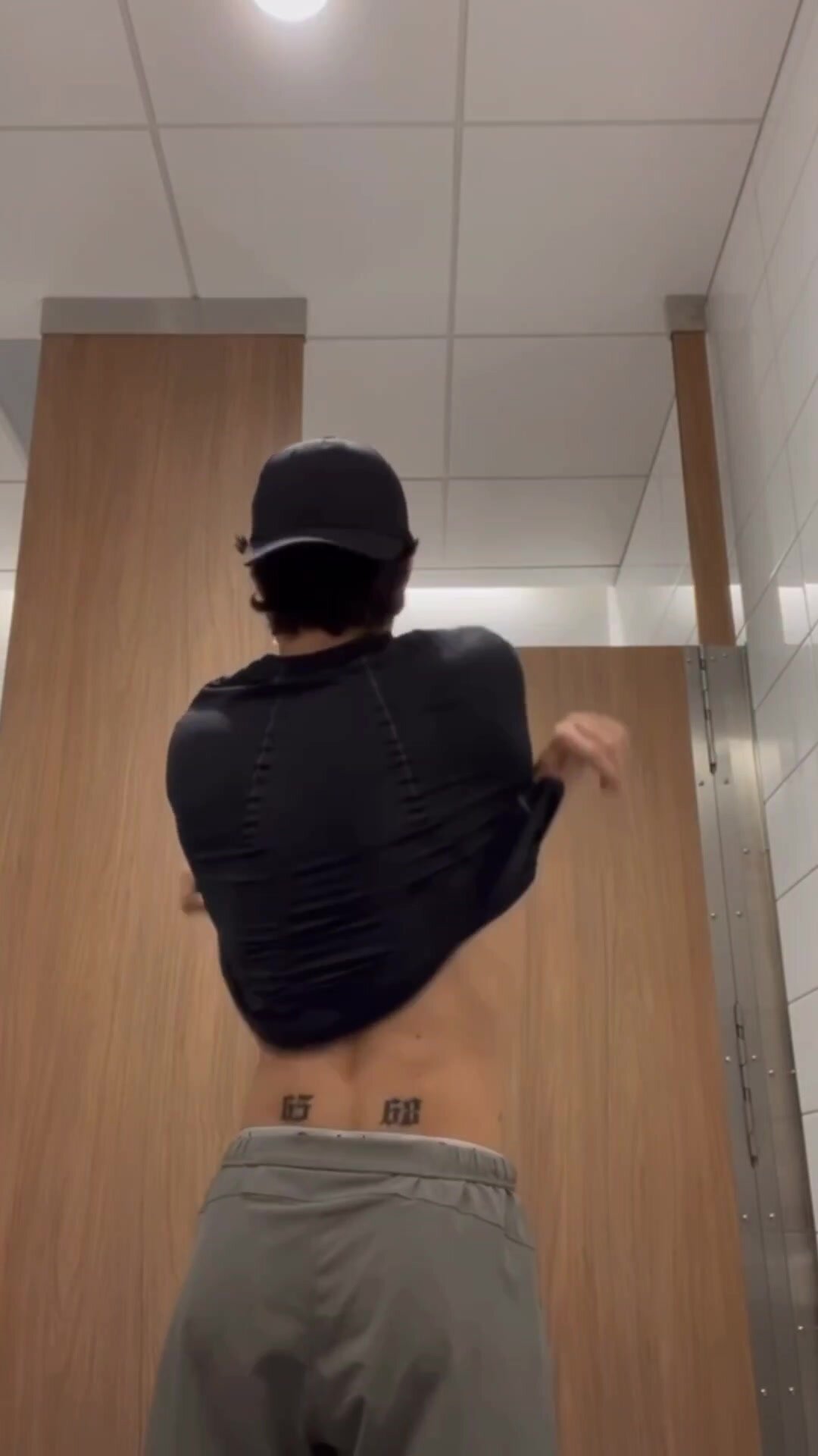 Tiktoker strips in gym bathroom