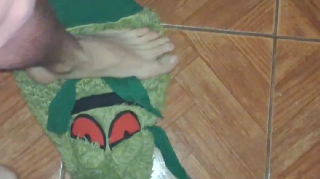 Barefoot trampling a soft toy