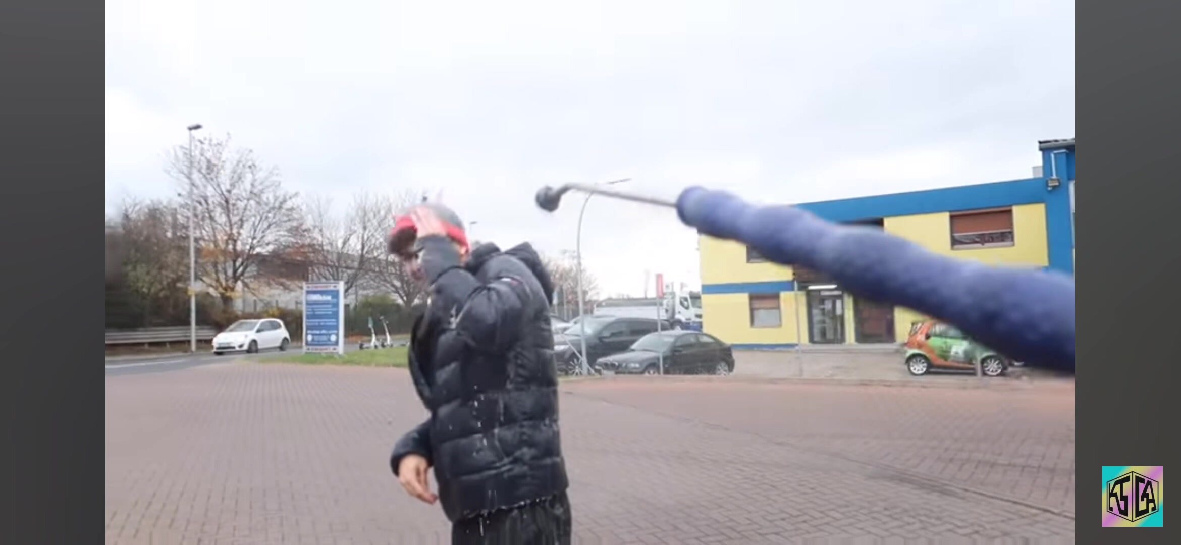 Man gets soaked at car wash in a puffer jacket