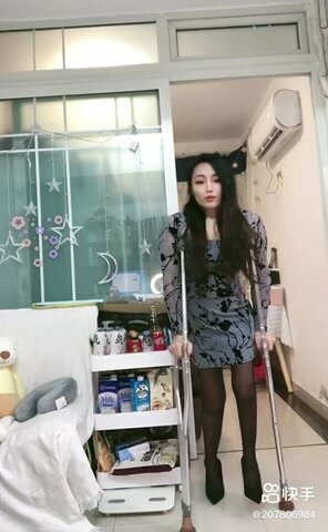 Beautiful Asian amputee girl crutching with high heels