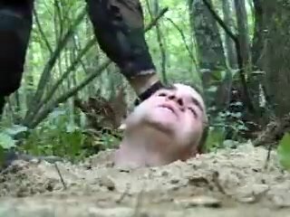 Helpless, Buried Slave Gets Kicked by Boots