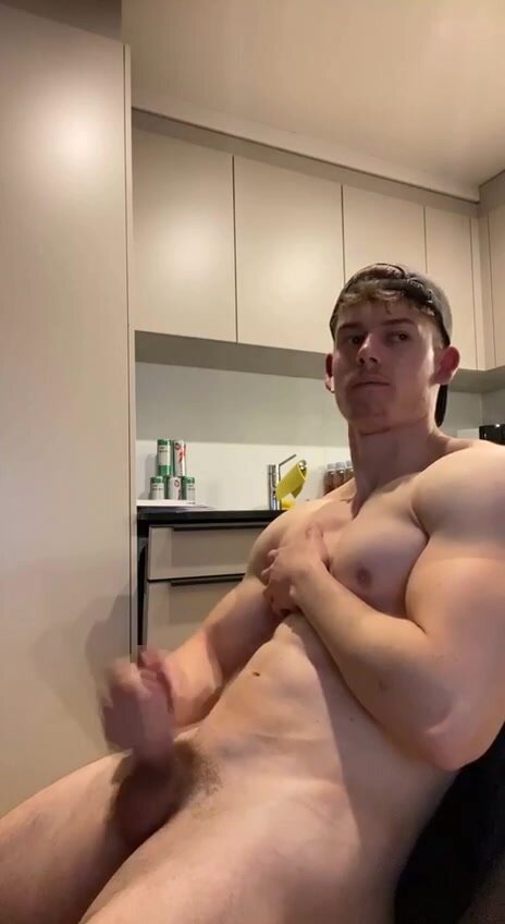 Muscle dude blows load in kitchen