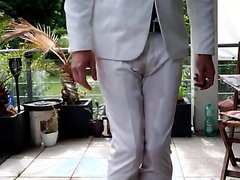 man pees his suit