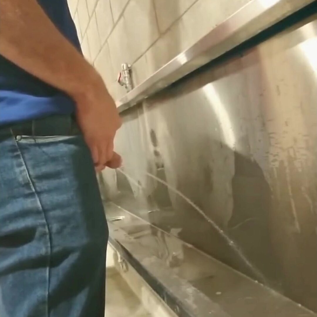 Side by Side at Stadium Urinal