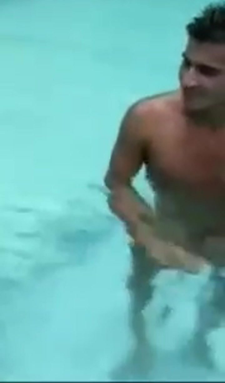 2 men remove their speedos in the pool