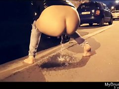 Girl with great ass pissing on the street.
