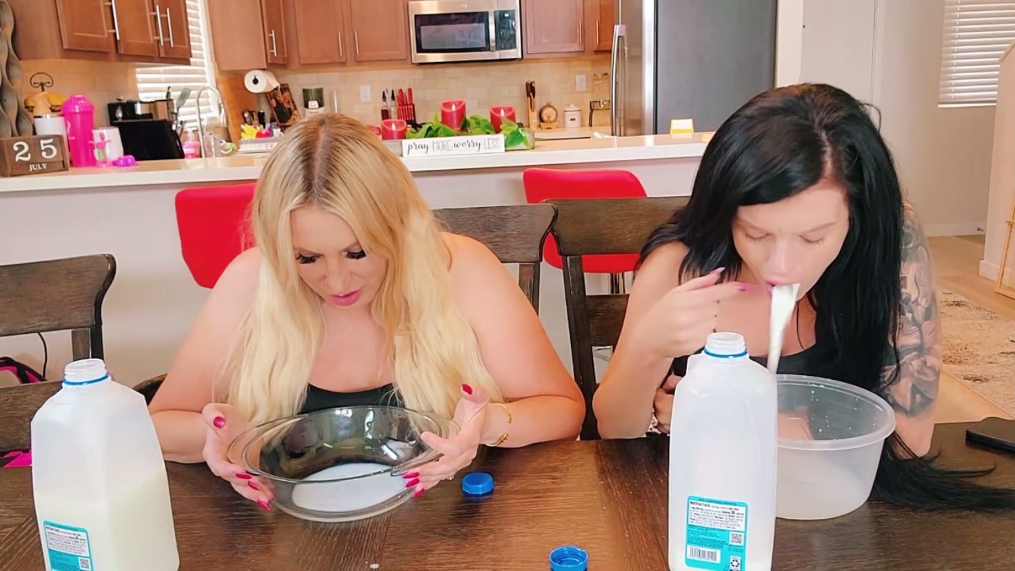 Two girls puking milk