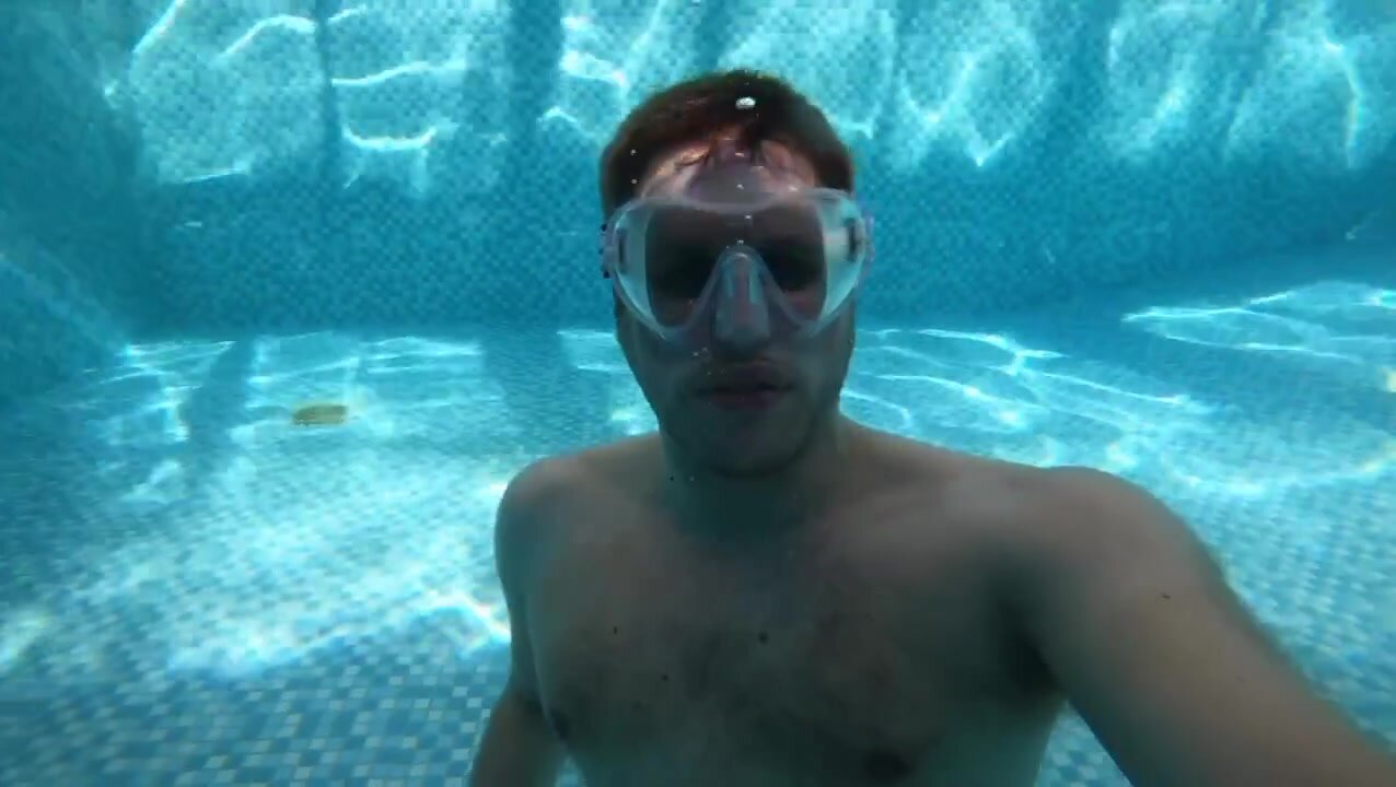 Masked hairy hottie letting air out underwater