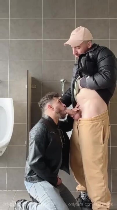 Two Guys in Leather and Down Jackets Fucking in Toilet