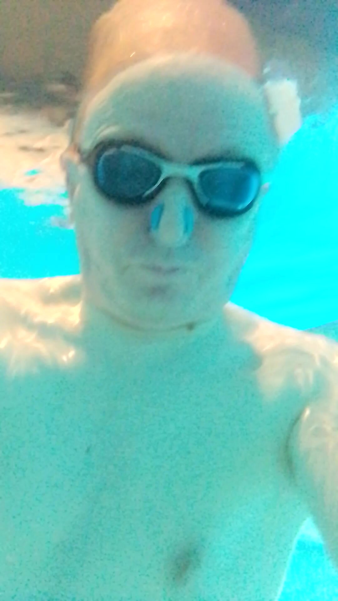 nude underwater wearing cockring in private indoor pool