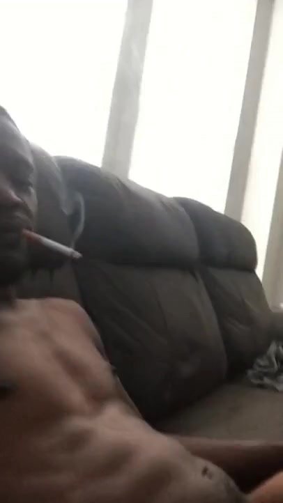 sexy black dude smokes while fag services him