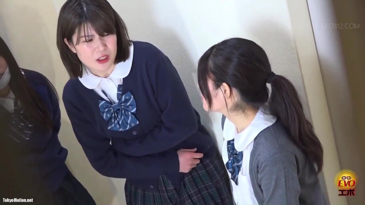 Three japanese girls desperately waiting to pee