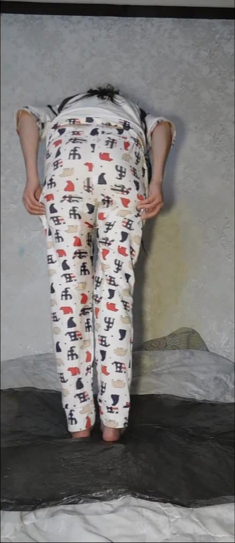 Sexy girl wets her pyjama pants