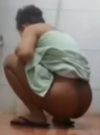 Asian girl squat pee on bathroom floor
